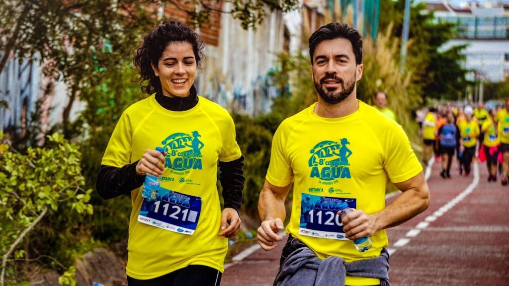 Two athletes participating in a marathon, showing determination and joy.